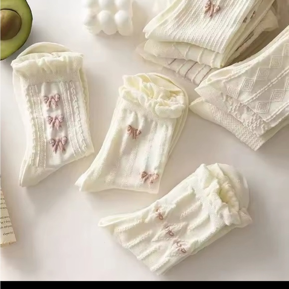 Elegant Cream Socks with Bow Accents
0219 - Picture 2 of 5